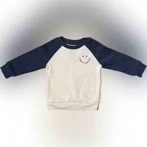 Cute Smiley Face Sweatshirt with Small Graphic on Front